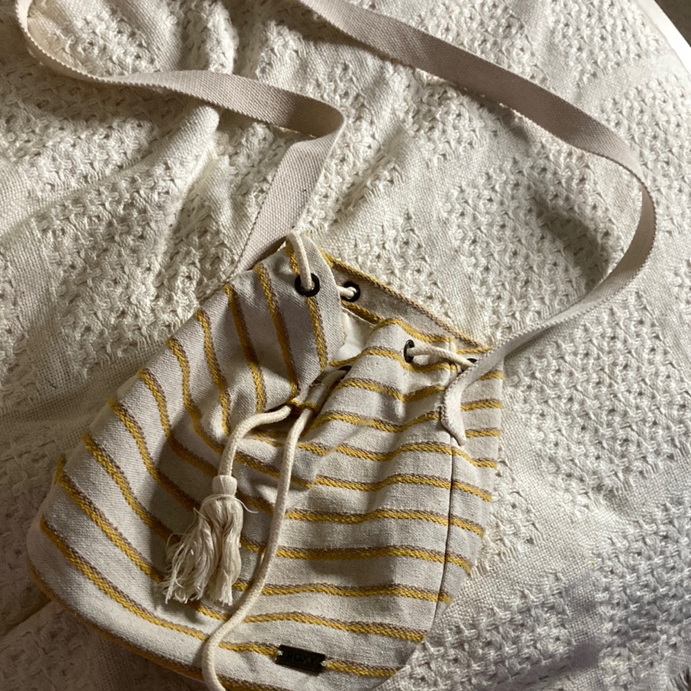 It’s a yellow and white bag. It looks small but actually can fit a lot.